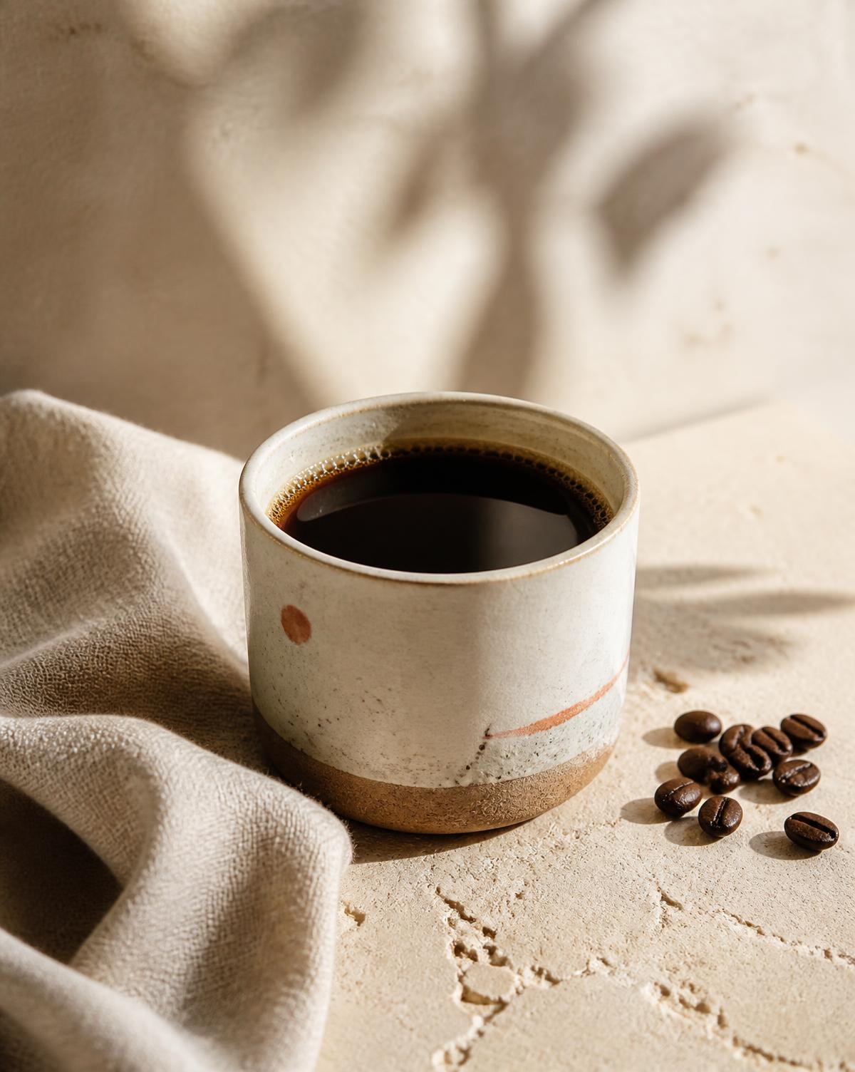 Handmade ceramic cup filled with filter coffee